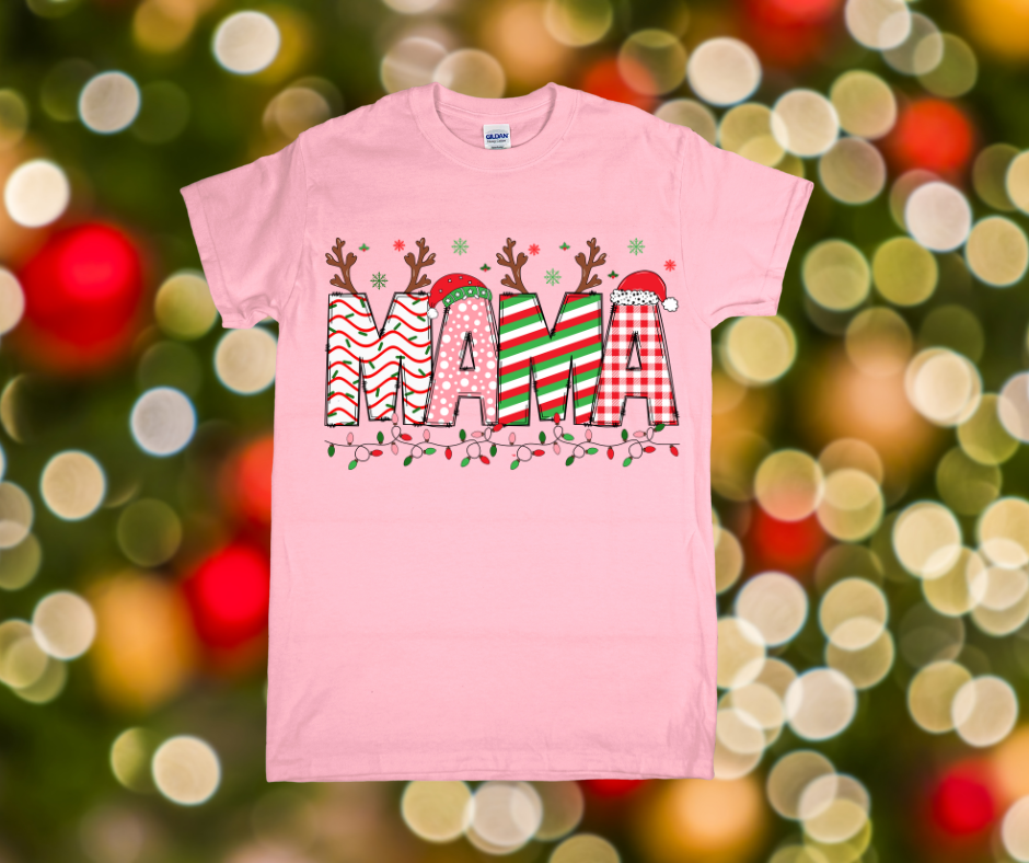 Pink t-shirt with 'MAMA' design featuring reindeer antlers and candy cane patterns on a festive background.