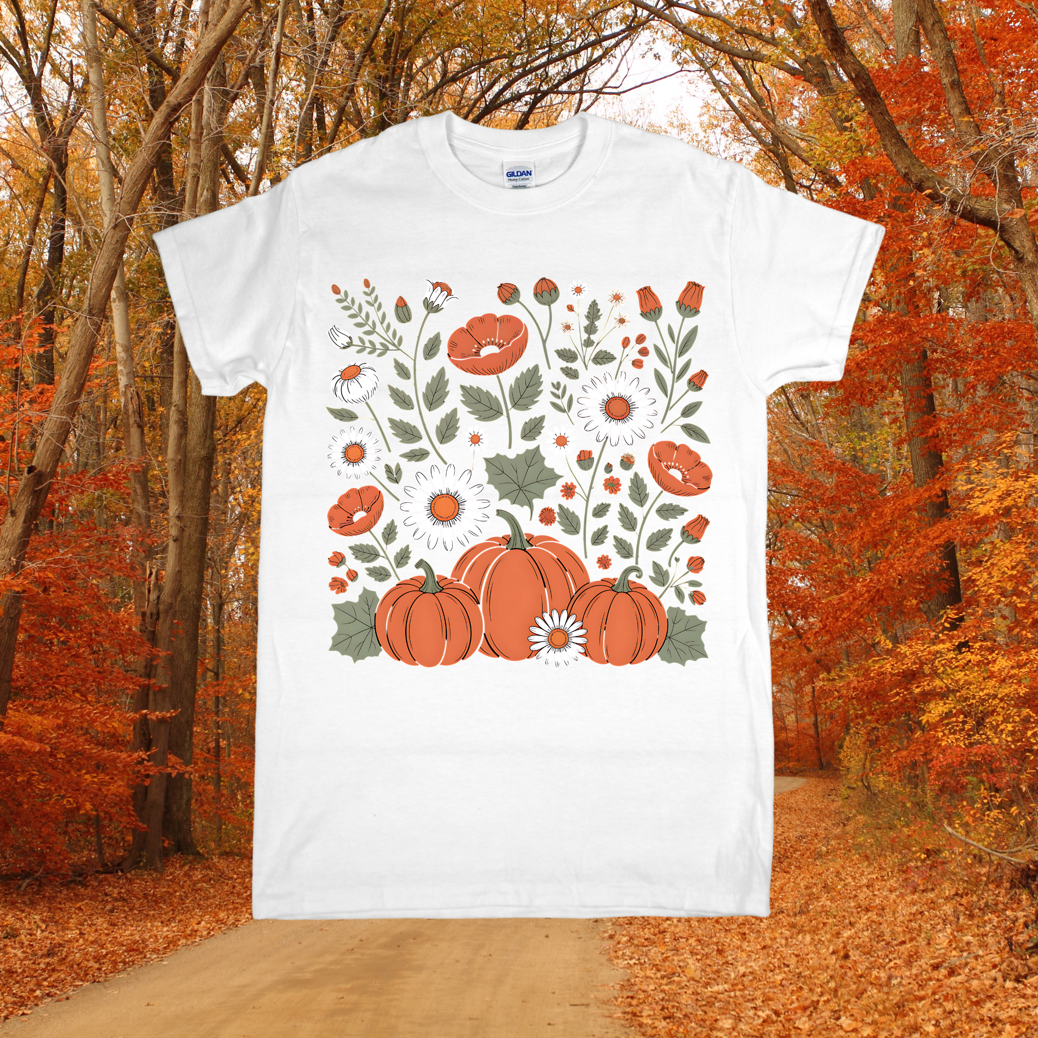 White t-shirt with pumpkins and floral design in an autumn forest setting