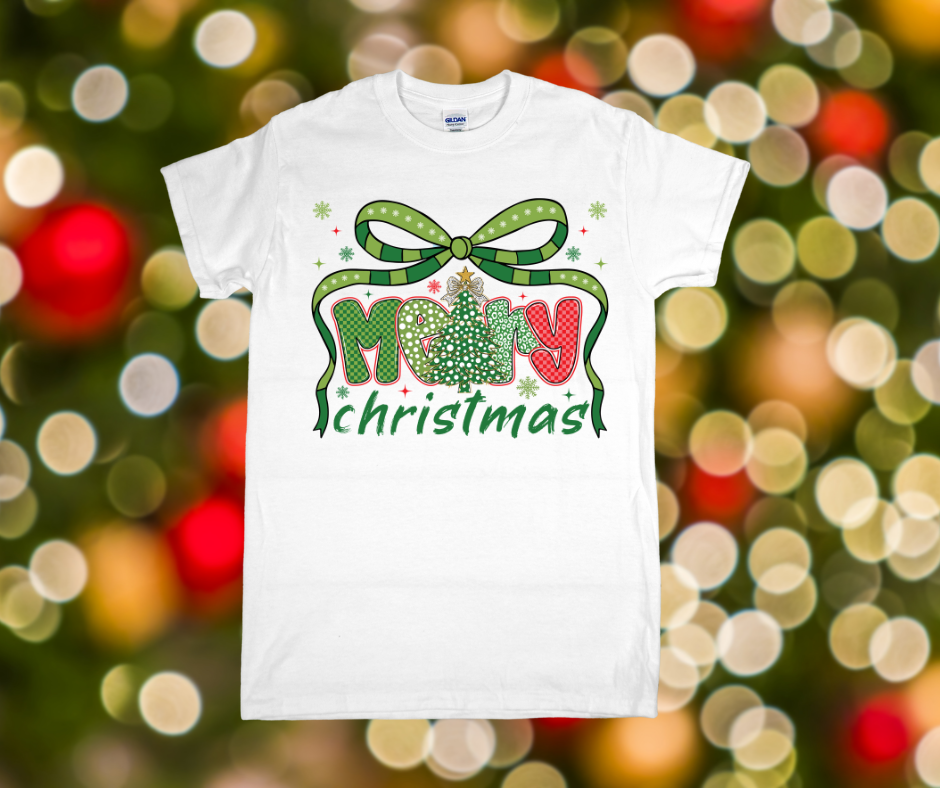 White t-shirt with 'Merry Christmas' design on a festive background
