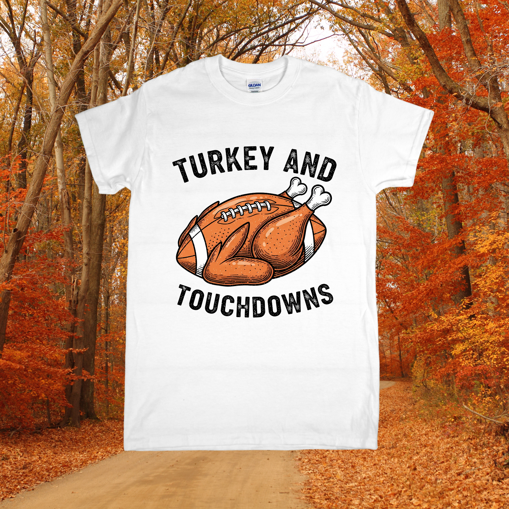 White t-shirt with 'Turkey and Touchdowns' design in an autumn forest setting