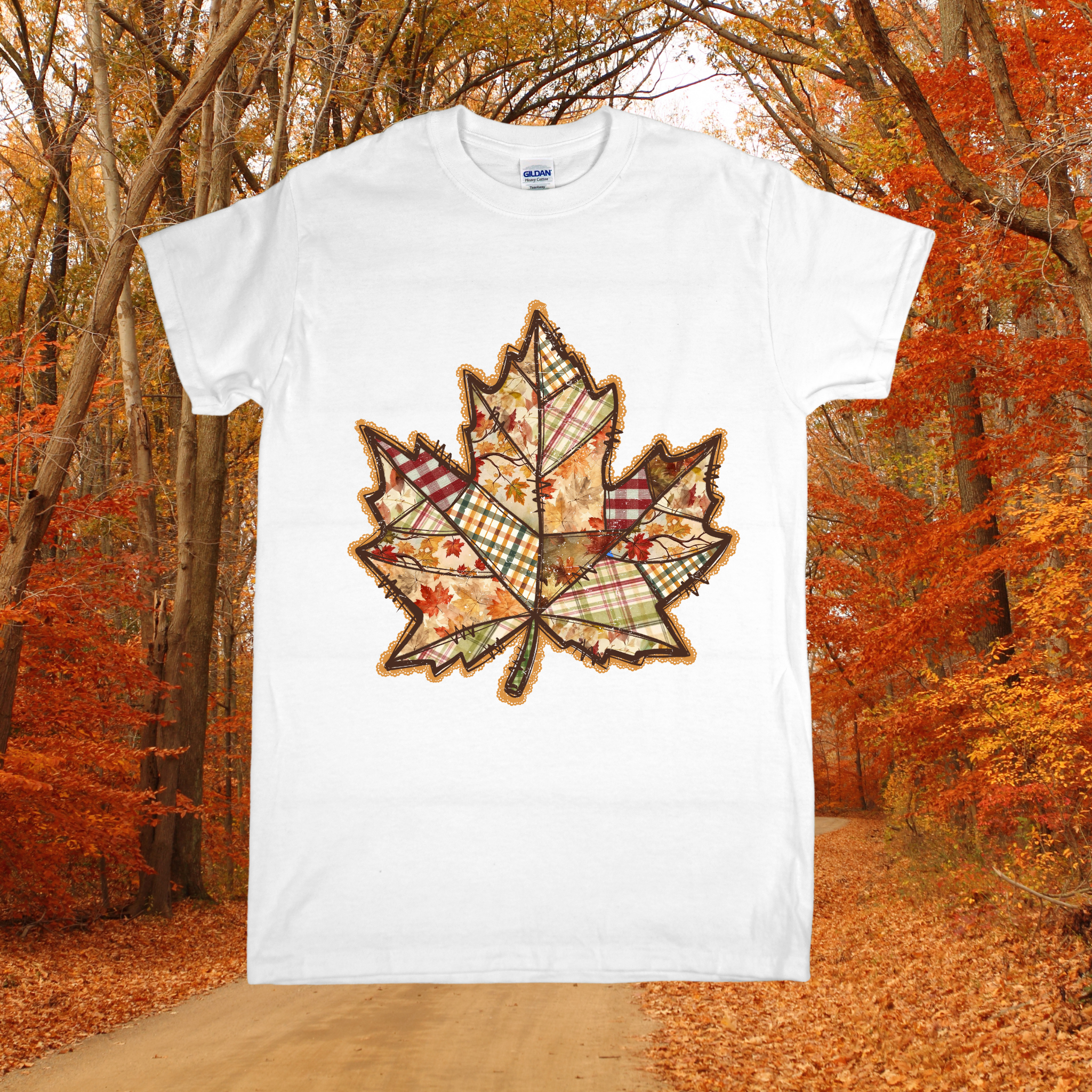 White t-shirt with a plaid leaf design in an autumn forest setting