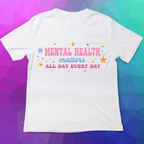 White t-shirt with 'Mental Health Matters All Day Every Day' text on a colorful geometric background