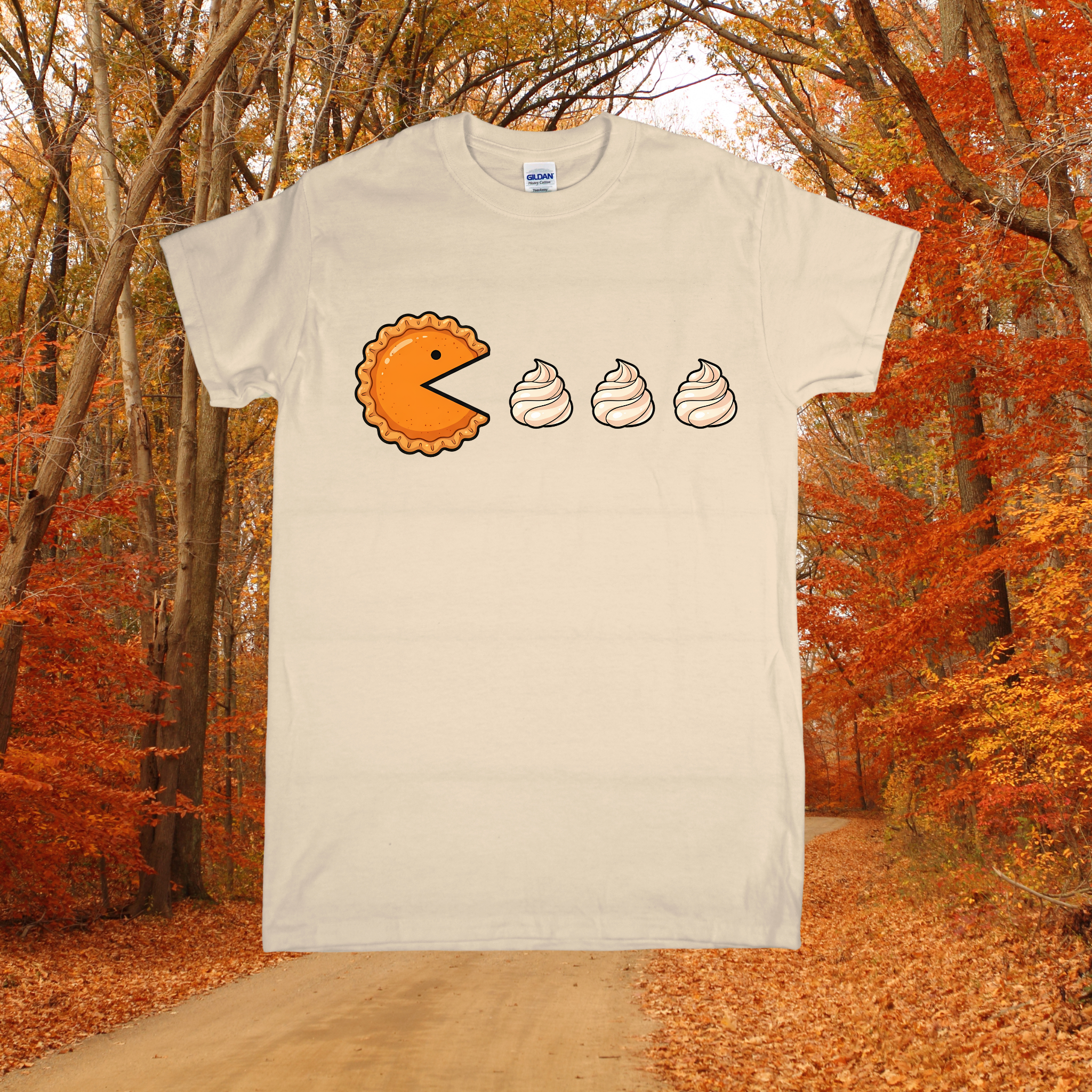 T-shirt with a graphic design of a pie and threepuddings on a background of autumn trees.