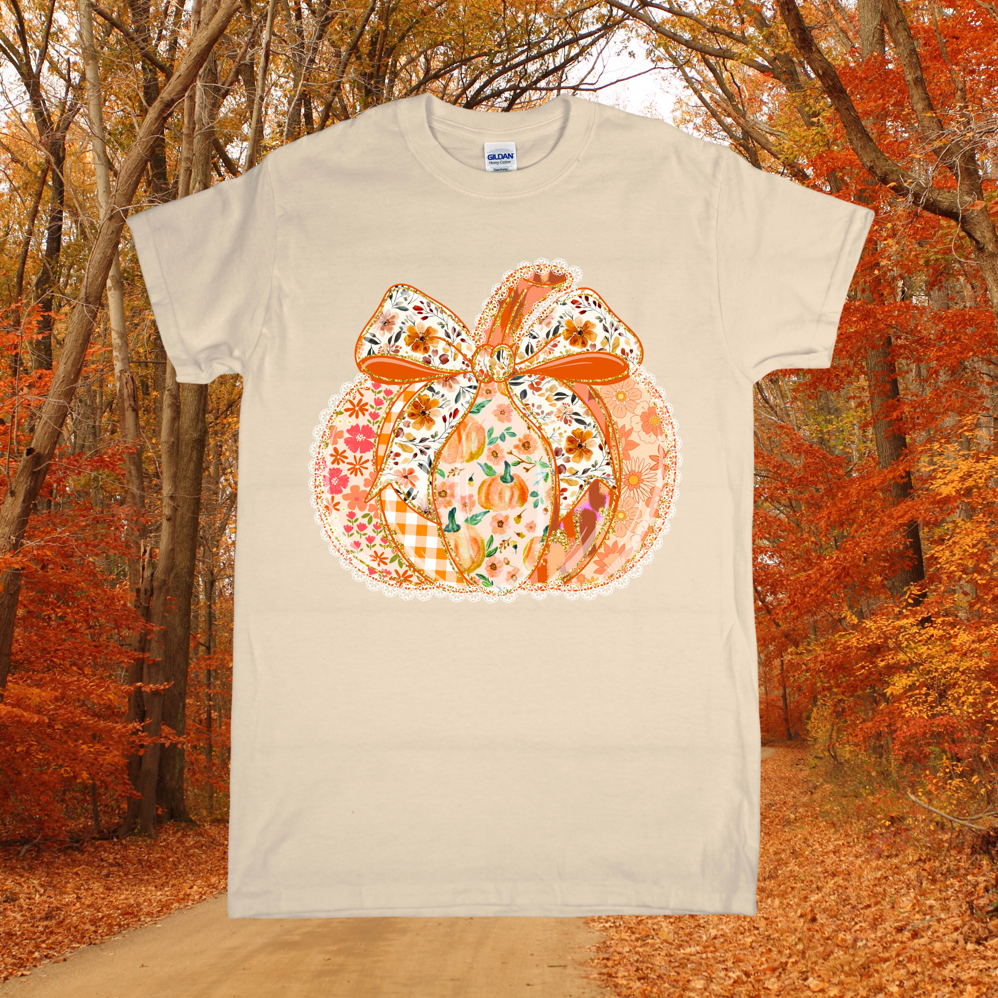 Beige t-shirt with a floral pumpkin design in an autumn forest setting