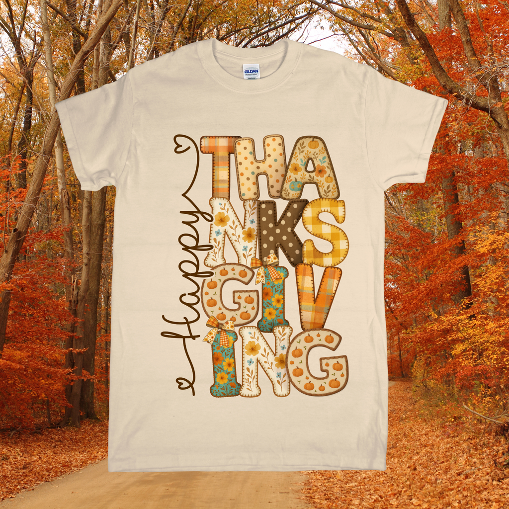 Beige t-shirt with 'Happy Thanksgiving' design in an autumn forest setting