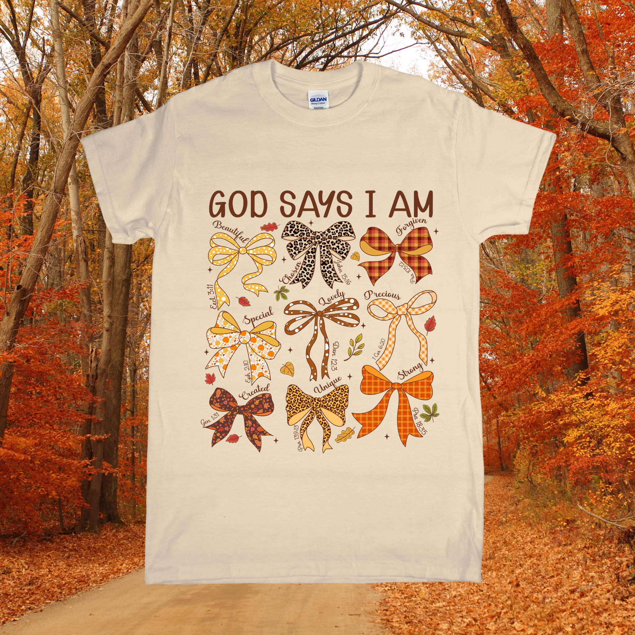 T-shirt with decorative bows and text 'GOD SAYS I AM' against a forest background