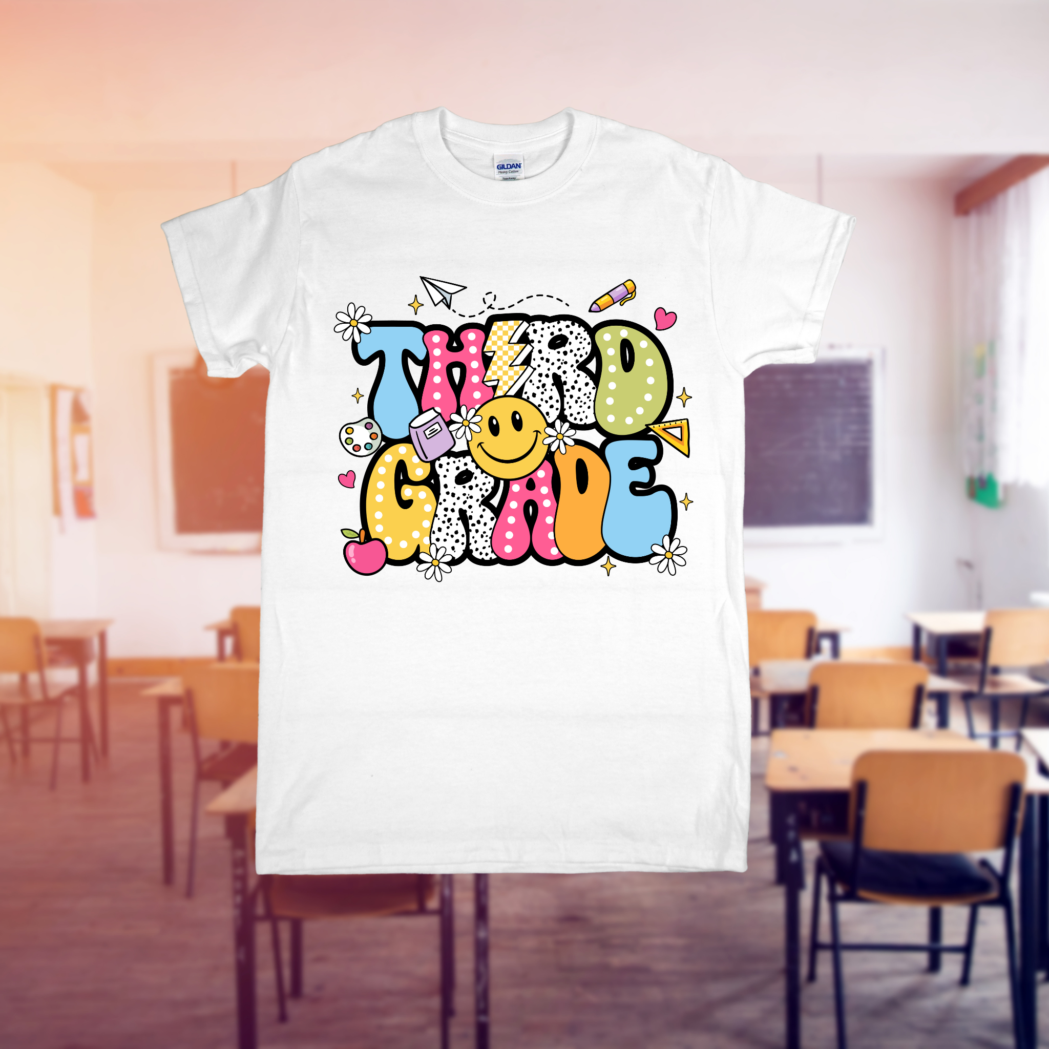 White t-shirt with colorful text design in a classroom setting