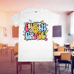 White t-shirt with 'Fourth Grade' design in a classroom setting