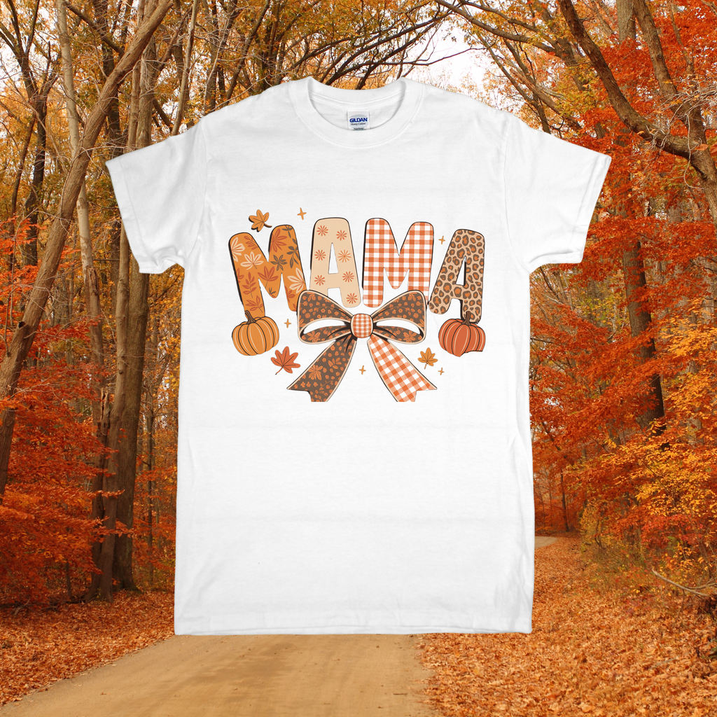 White t-shirt with 'MAMA' design in an autumn forest setting